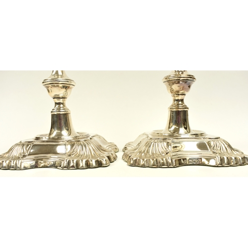 8002 - A pair of William Hutton & Sons Ltd large silver weighted based candlesticks of classic design, Lond... 