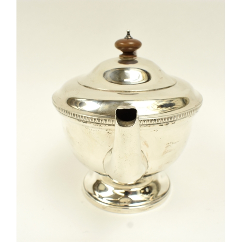 8034 - A Jay Richard Attenborough Co Ltd silver teapot with treen handle, Chester 1933, 446g