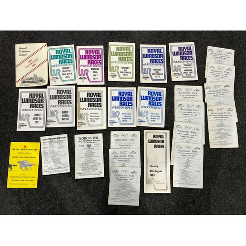 A box containing old race cards from various horse racing venues