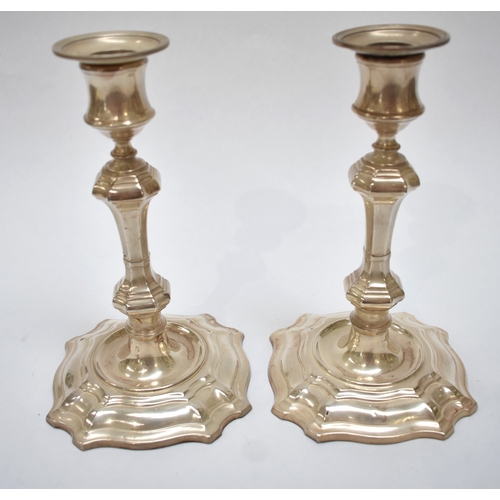 8010 - A pair of William Hutton & Sons Ltd London silver candlesticks. Weighted base, Marks worn, 19cm tall