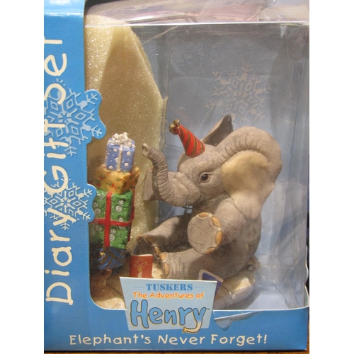 4025 - Four 'Tuskers' resin elephants and Five 'Henry' resin elephants, boxed (9)