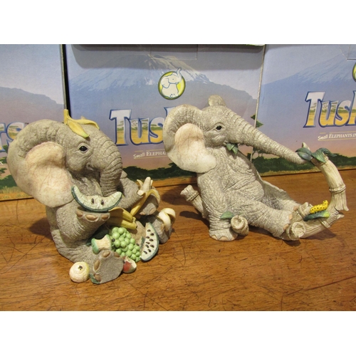 4027 - Four 'Tuskers' resin Elephant figures, all boxed
