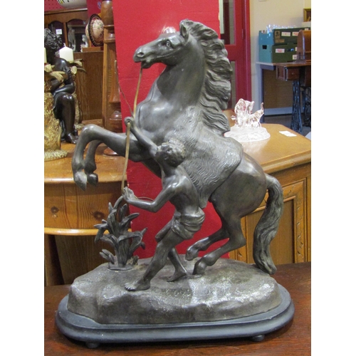 4062 - A spelter figure of Alexander taming Bucephalus, 42cm tall