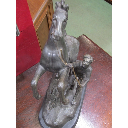 4062 - A spelter figure of Alexander taming Bucephalus, 42cm tall