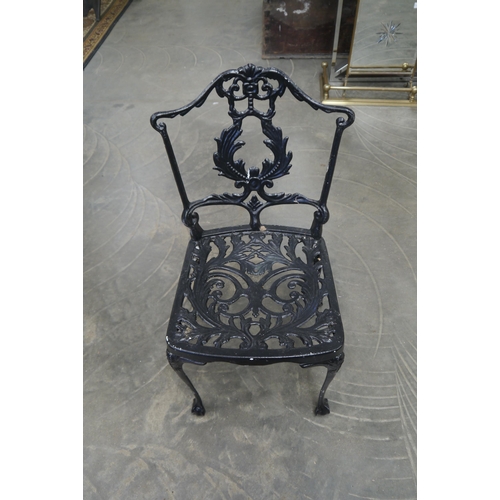2009 - A cast iron based pub table and four alloy garden chairs