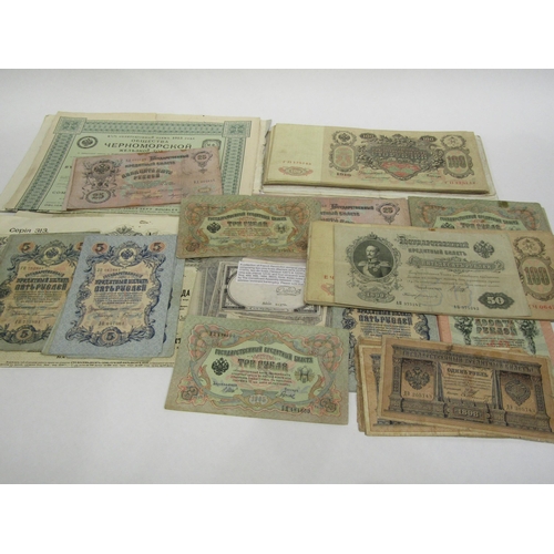 A folder of foreign bank notes, information notes enclosed