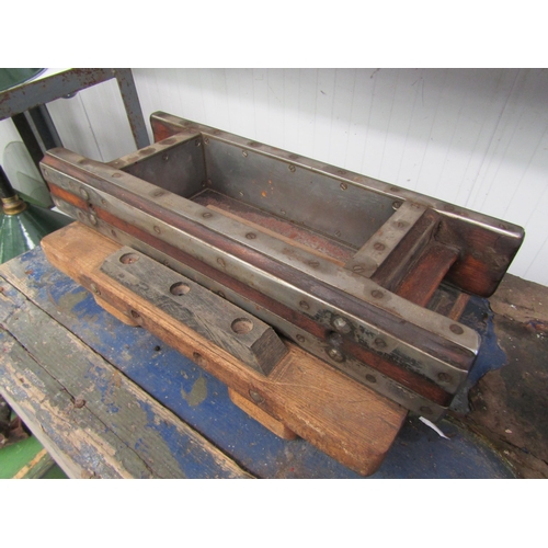 2044 - A hardwood and metal bound brick mould