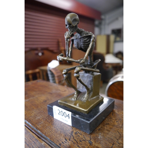 2004 - A desk top bronze skeleton thinker on marble base