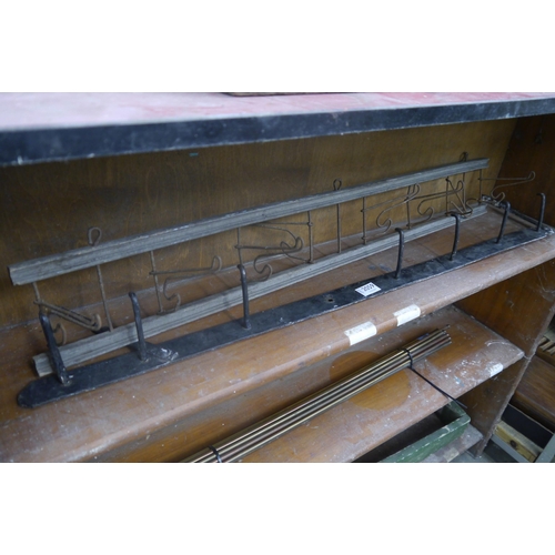 Two metal hook racks
