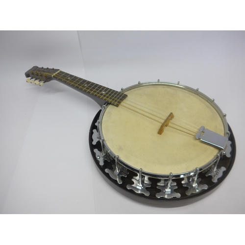 6057 - A vintage GH&S Melody Major mandolin banjo, and a round back mandolin with paper labels 