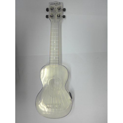 6062 - A Makala Waterman clear perspex ukelele and a didgeridoo (2)
