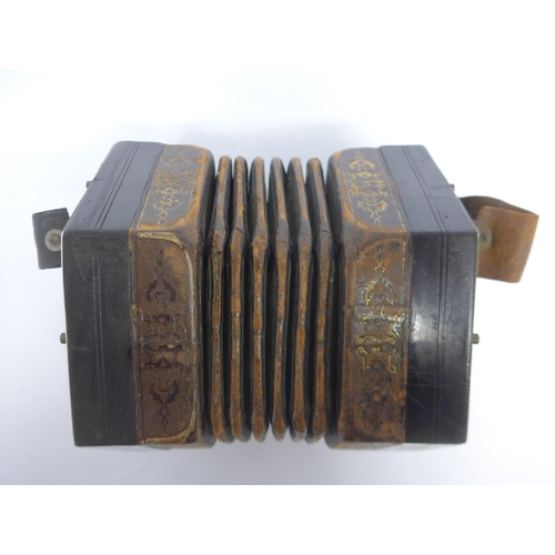 6147 - A Charles Jeffries hexagonal concertina with thirty-nine buttons and six-section leather bellows wit... 