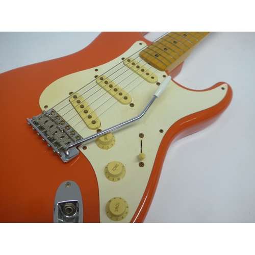 6018 - A 1996 Fender Hank Marvin Stratocaster electric guitar in Fiesta red finish, made in Japan (MIJ), 