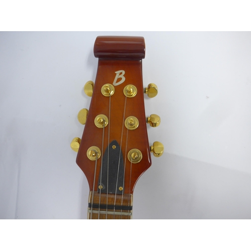 6005 - A Burns Shadow Club Series electric guitar in sunburst finish with pearloid three-section pickguard,... 