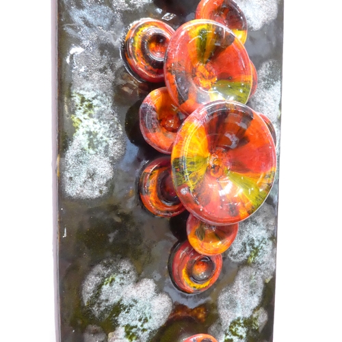 7005 - A West German Ruscha Pottery wall tile plaque with orange larva glazed mushroom detail, metal chain ... 