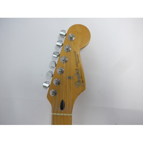 6020 - A Fender Stratocaster electric guitar in metallic red finish, made in Mexico (MIM), serial no. MN626... 