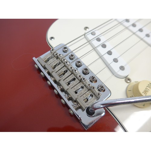 6020 - A Fender Stratocaster electric guitar in metallic red finish, made in Mexico (MIM), serial no. MN626... 