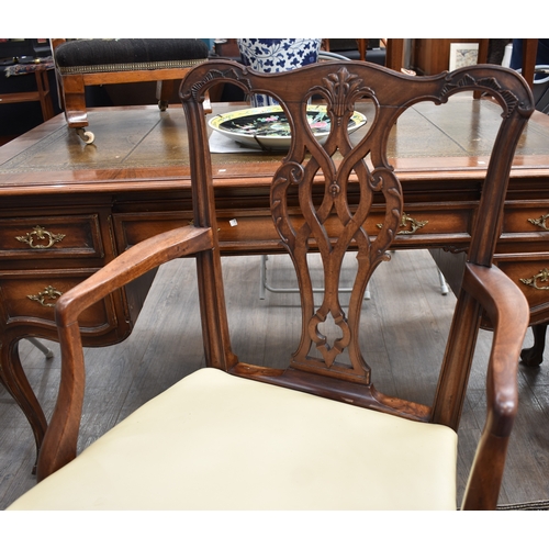 4002 - A Georgian mahogany open armchair with leather seat and brass stud decoration