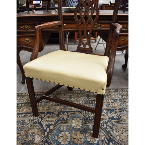 4002 - A Georgian mahogany open armchair with leather seat and brass stud decoration