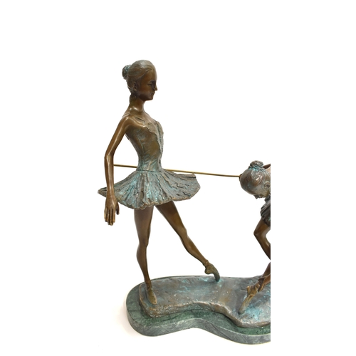 4029 - A pair of contemporary verdigris bronze ballerinas, 32cm tall x 35cm long