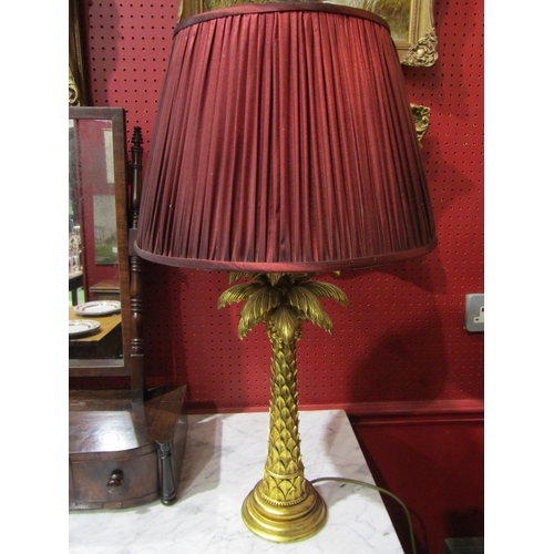 4042 - A gilt painted palm tree style table lamp with shade, 68cm tall