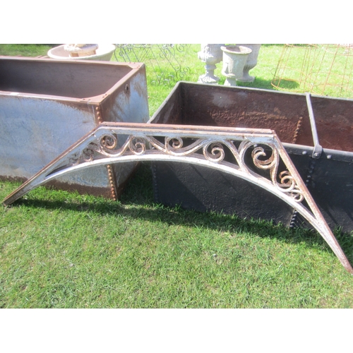 8018 - A pair of decorative iron roof brackets