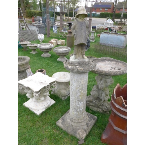 8023 - A stone plinth surmounted with a composition figure of Christopher Robin, figure is 57cm tall, plint... 