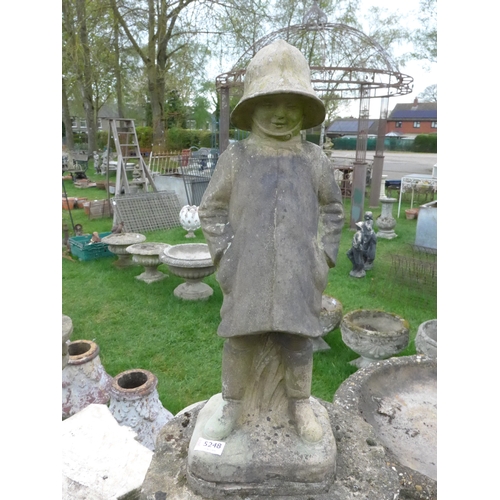 8023 - A stone plinth surmounted with a composition figure of Christopher Robin, figure is 57cm tall, plint... 