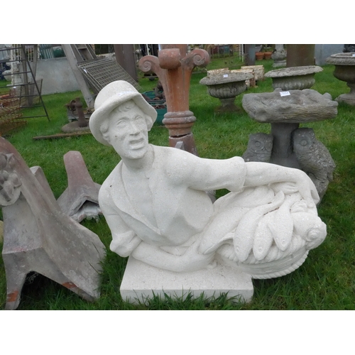 8034 - An Italian limestone figure of a fisherman with basket of fish, 59cm tall x 60cm wide approx