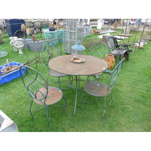8022 - A round metal garden table and four chairs