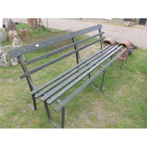 8029 - An iron and wooden slatted garden bench, 213cm wide