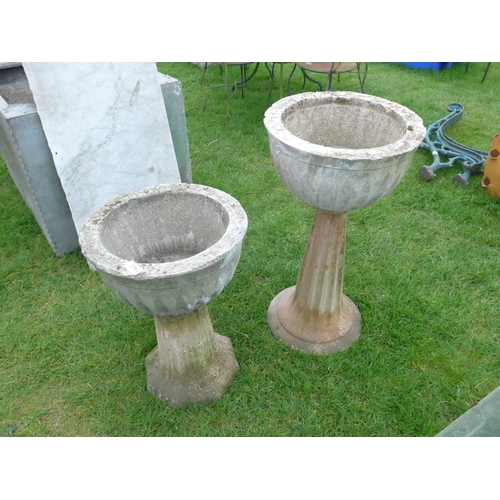 8028 - Two fluted composition urns on stand