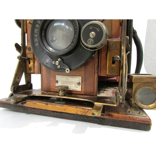 7009 - An early 20th Century Sanderson of London Hand and Stand quarter-plate camera with red bellows, seri... 