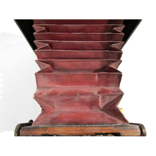 7009 - An early 20th Century Sanderson of London Hand and Stand quarter-plate camera with red bellows, seri... 