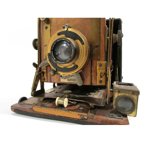 7008 - An early 20th Century Sanderson of London Hand and Stand quarter-plate camera with black bellows, se... 