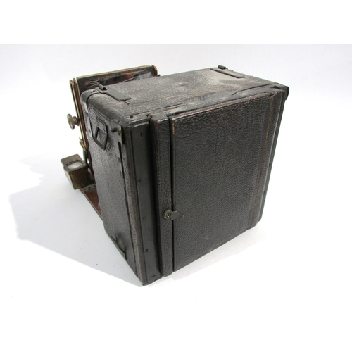 7008 - An early 20th Century Sanderson of London Hand and Stand quarter-plate camera with black bellows, se... 