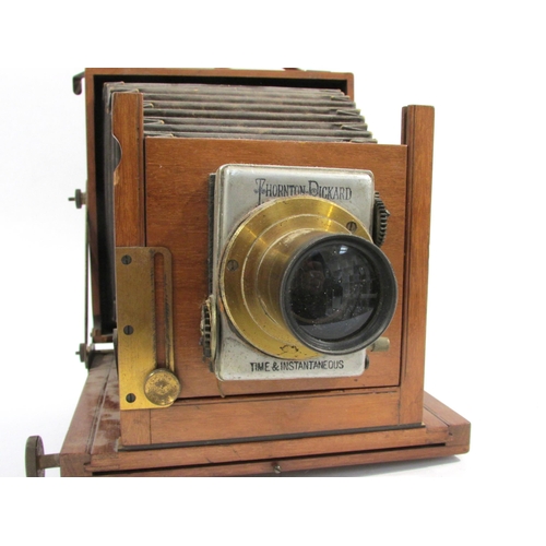 7005 - A mahogany and brass half-plate field camera with Thornton-Pickard Time & Instantaneous shutter, unn... 