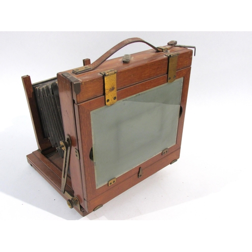 7005 - A mahogany and brass half-plate field camera with Thornton-Pickard Time & Instantaneous shutter, unn... 