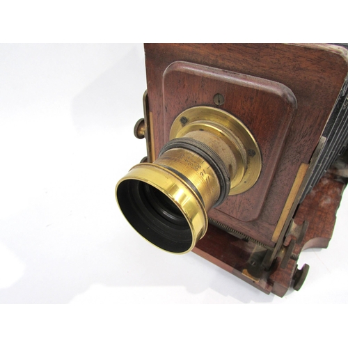 7003 - A Lancaster's Patent mahogany and brass half-plate field camera, black bellows in good order, unname... 