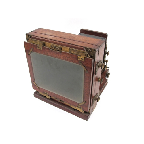 7003 - A Lancaster's Patent mahogany and brass half-plate field camera, black bellows in good order, unname... 