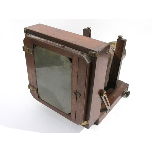 7007 - A late 19th Century mahogany and brass half-plate field camera with a brass (Jules) Vogal of Philade... 
