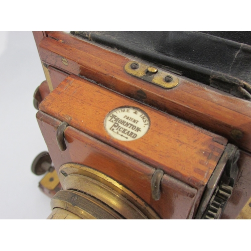 7010 - A Houghton (and Ensign) 'Triple Victo' mahogany and brass half-plate field camera with Thornton-Pick... 