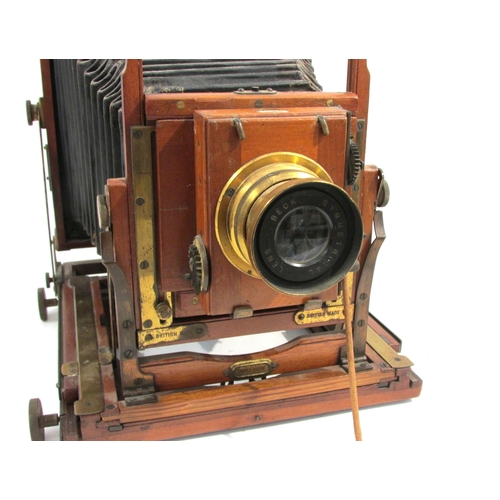 7010 - A Houghton (and Ensign) 'Triple Victo' mahogany and brass half-plate field camera with Thornton-Pick... 