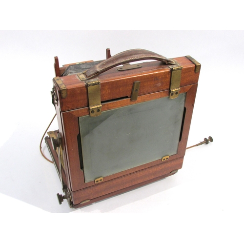 7010 - A Houghton (and Ensign) 'Triple Victo' mahogany and brass half-plate field camera with Thornton-Pick... 
