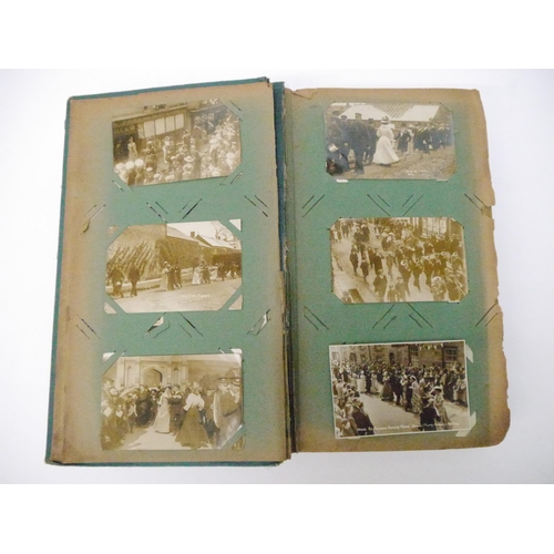 9102 - A large early 20th Century postcard album containing a good quantity (approx. 254) of interesting po... 