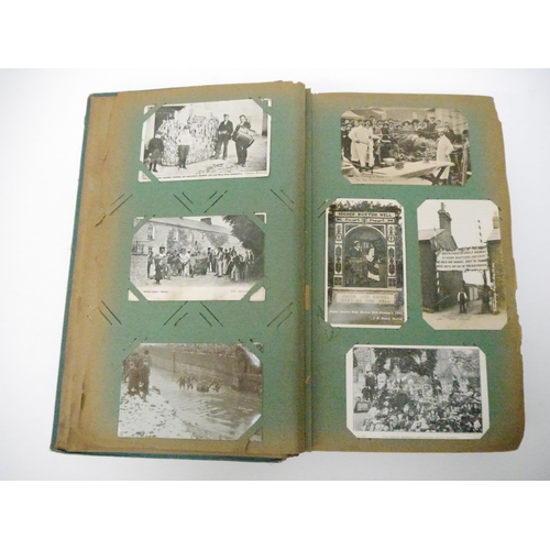 9102 - A large early 20th Century postcard album containing a good quantity (approx. 254) of interesting po... 