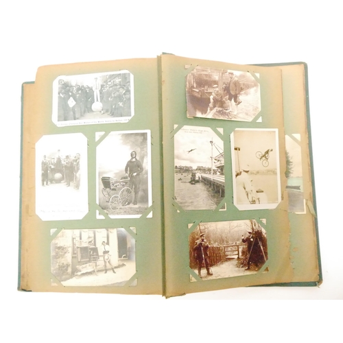 9102 - A large early 20th Century postcard album containing a good quantity (approx. 254) of interesting po... 