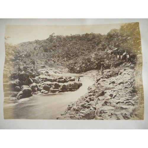 9044 - A 19th Century photograph album containing approx. 100 mounted albumen print etc photographs mainly ... 