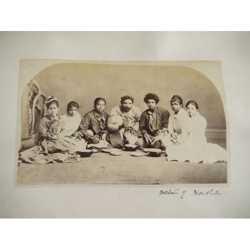 9044 - A 19th Century photograph album containing approx. 100 mounted albumen print etc photographs mainly ... 