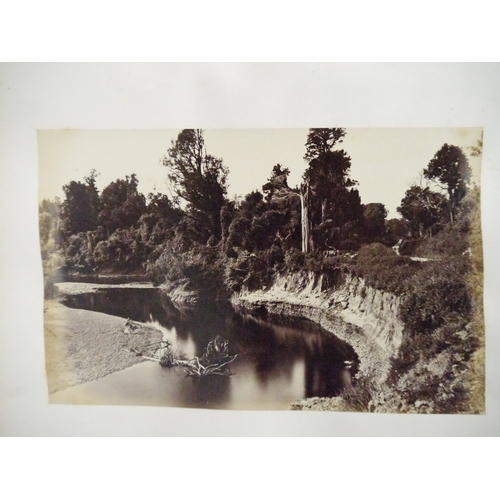 9044 - A 19th Century photograph album containing approx. 100 mounted albumen print etc photographs mainly ... 